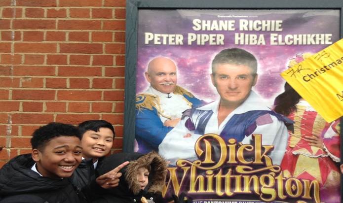 students by the panto poster