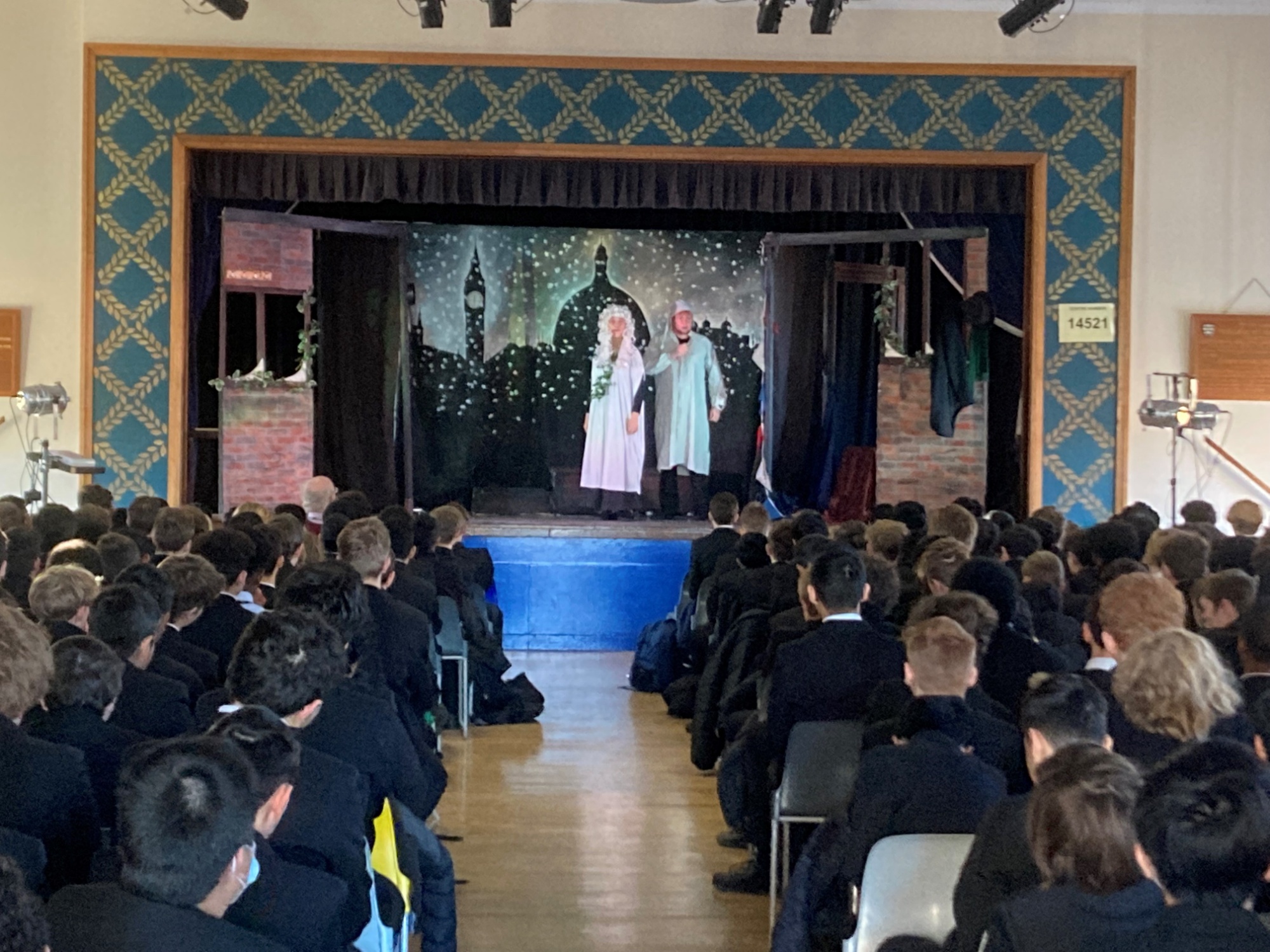performance of a Christmas carol in the school hall