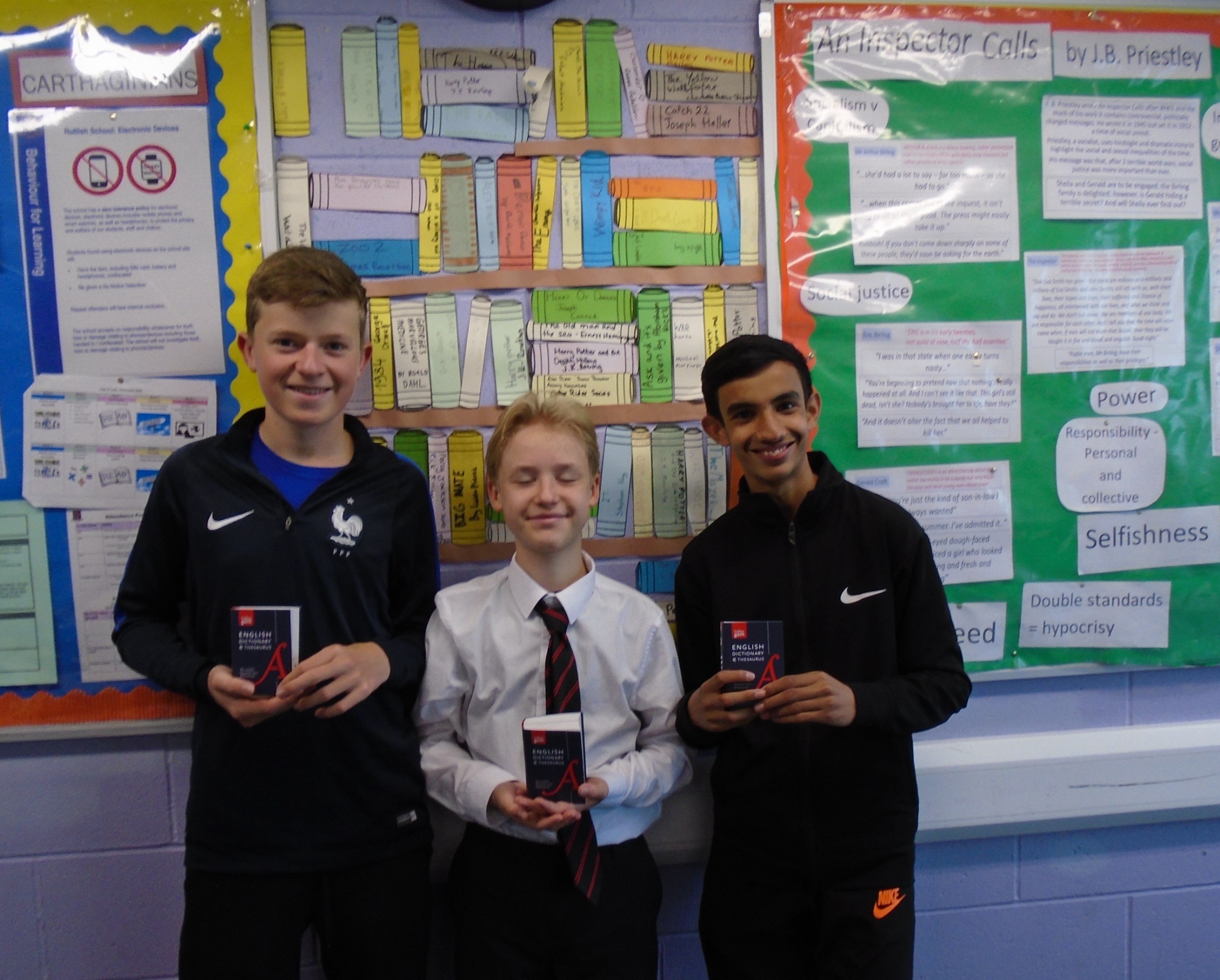 students holding their dictionaries