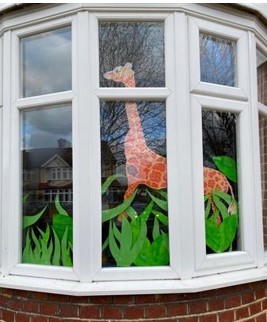 drawing of a giraffe in a window