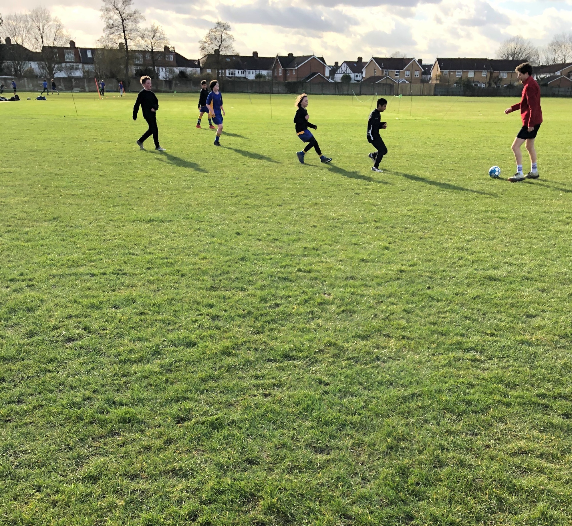 students playing football