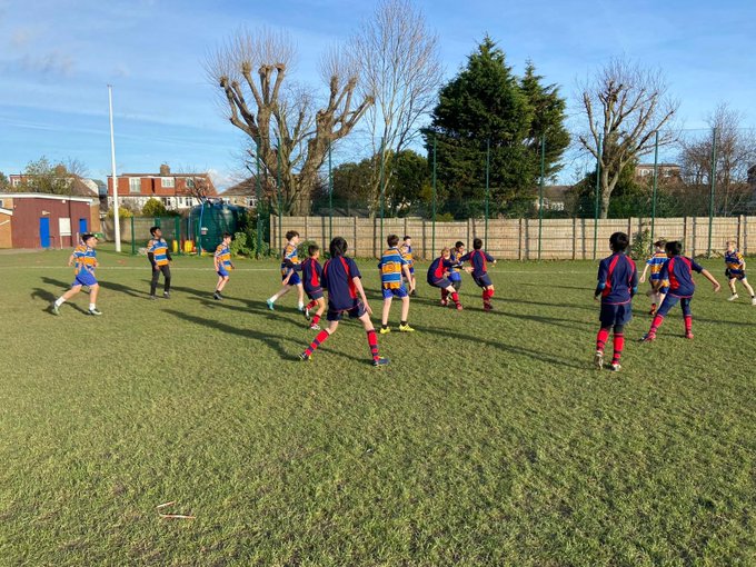 students playing rugby