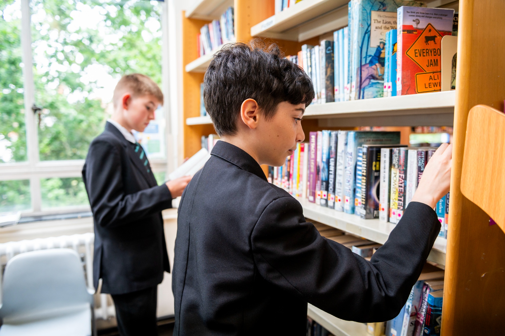 Students in the library looking at books