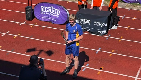 Student holding cup