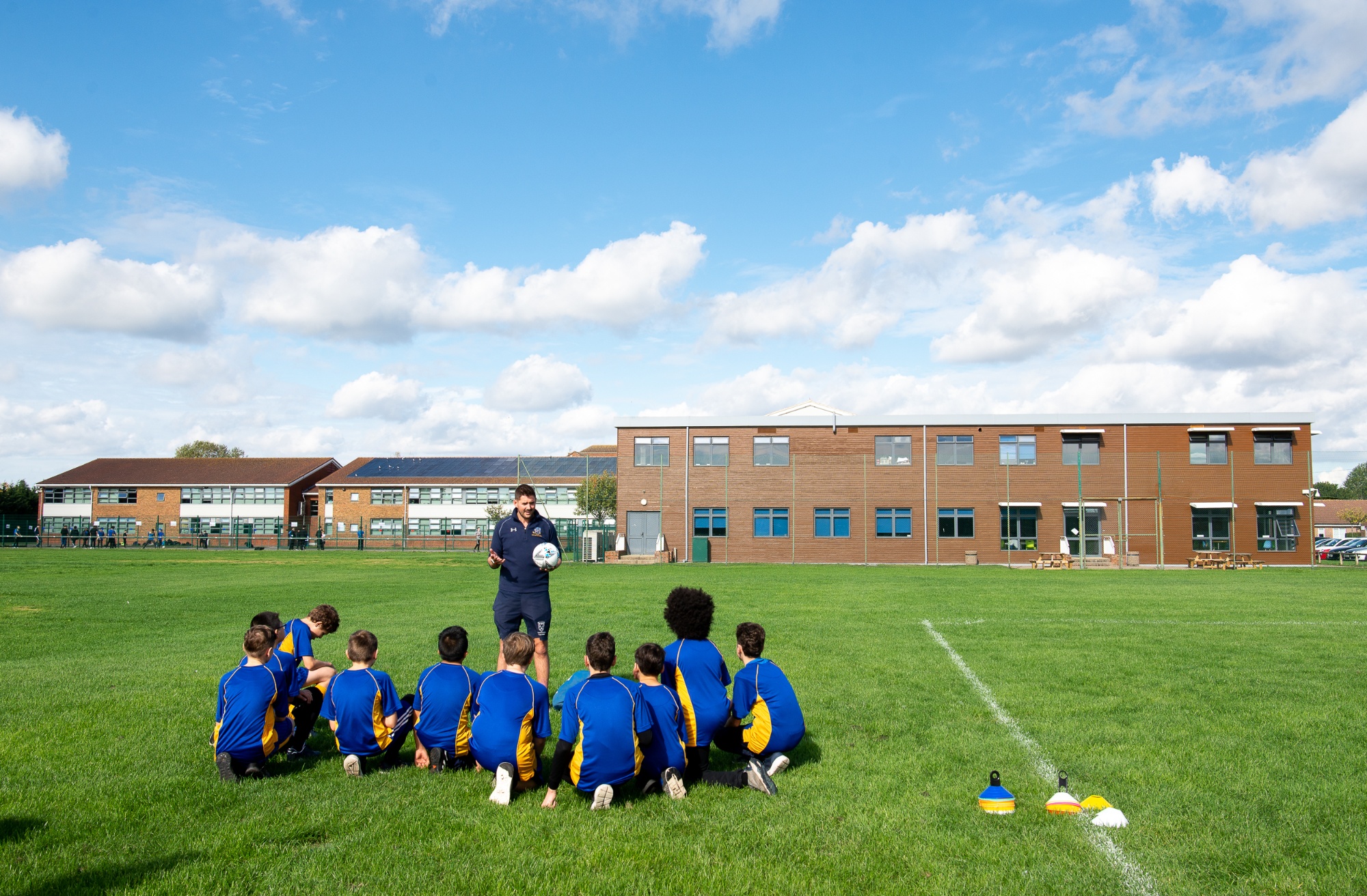 Rutlish students on the rugby field with their teacher