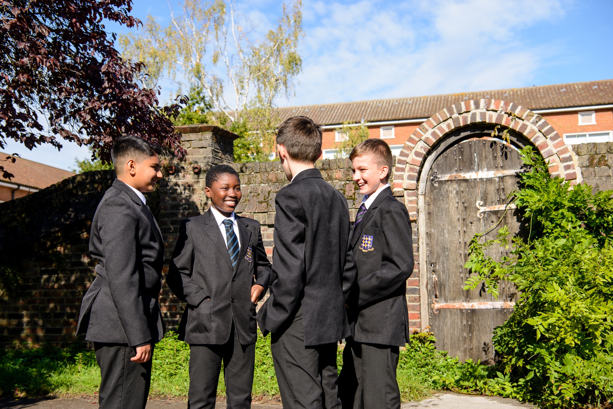 students standing near the old school gate