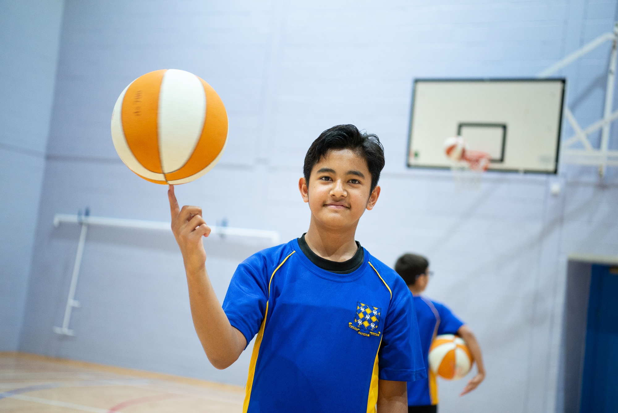 Rutlish student spinning a basketball on one finger
