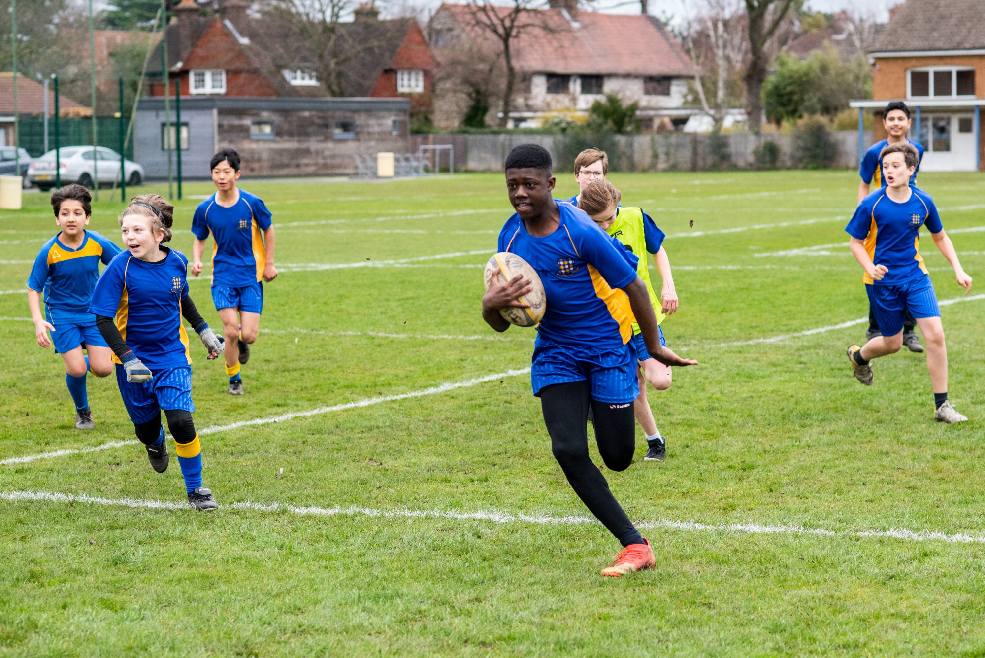 student playing rugby