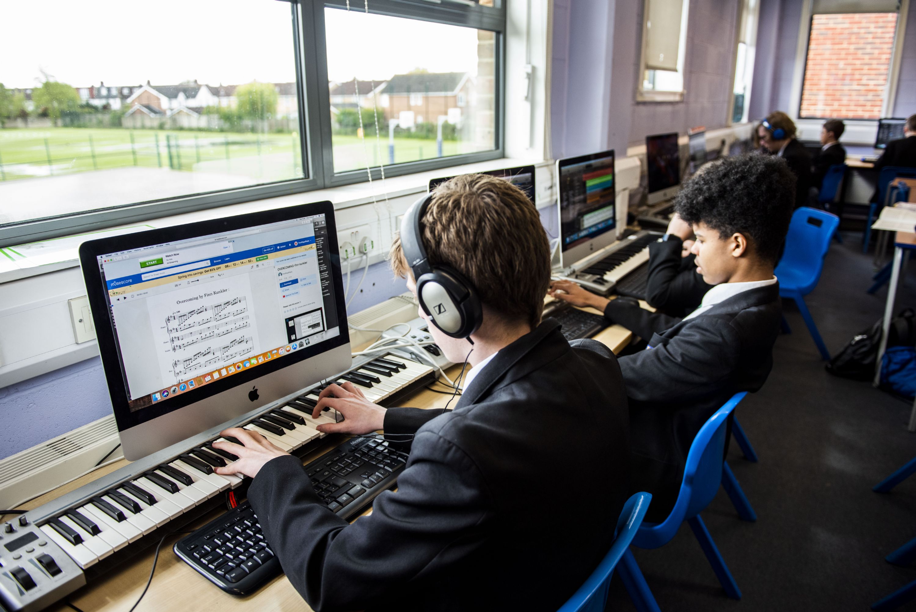 rutlish student playing keyboard